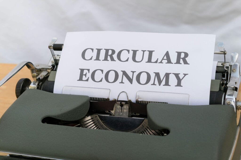 Vintage typewriter typing 'Circular Economy' document emphasizing sustainability.